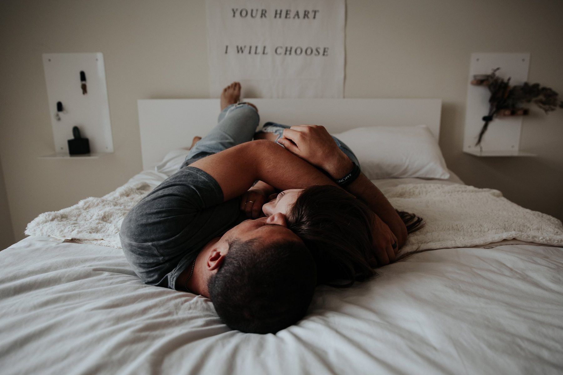 Couple embracing in bed