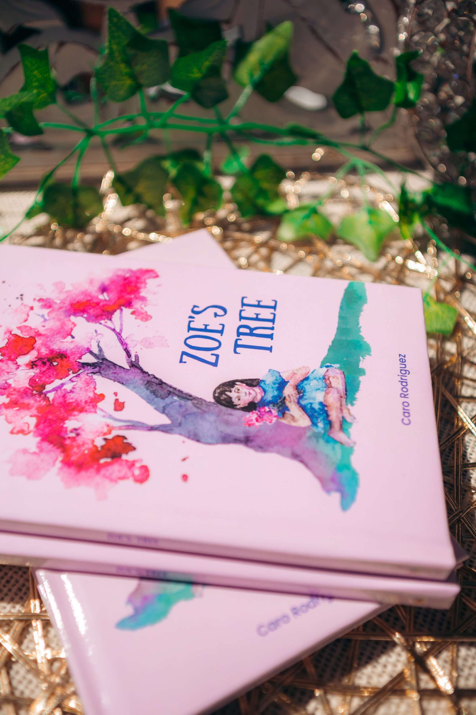 Copies of the children's book Zoe's Tree by Caro Rodriguez