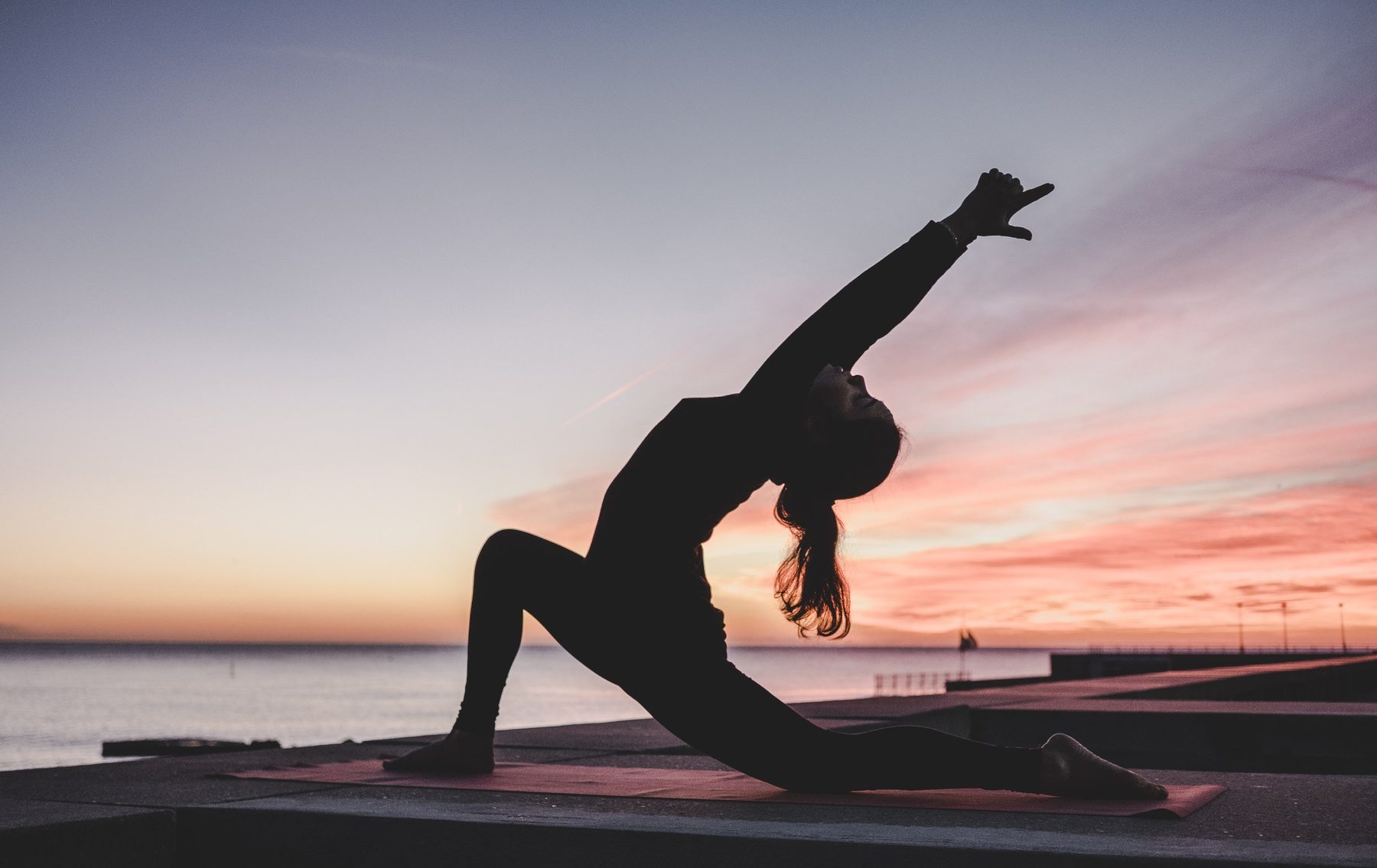Woman in a heart-opening yoga pose