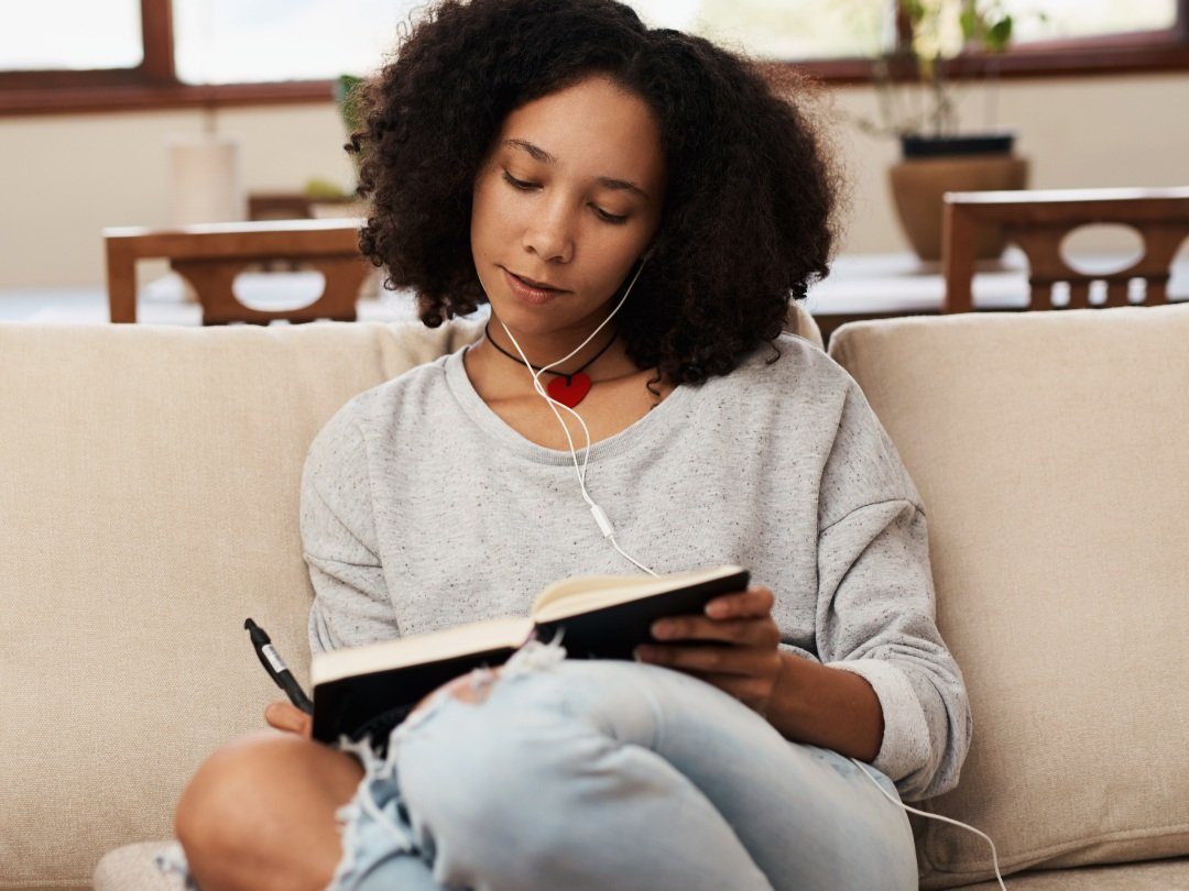 Woman journaling and relaxing