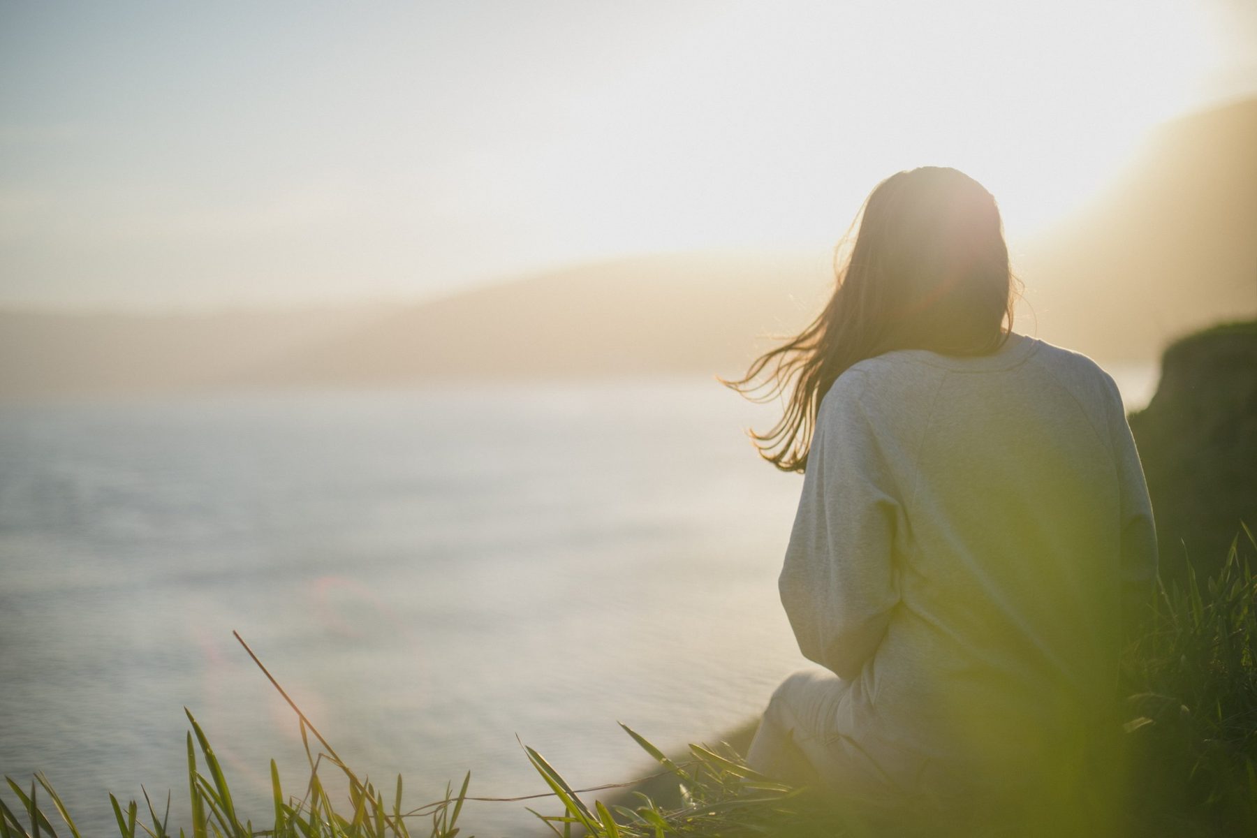 Woman feeling powerless looking at the ocean