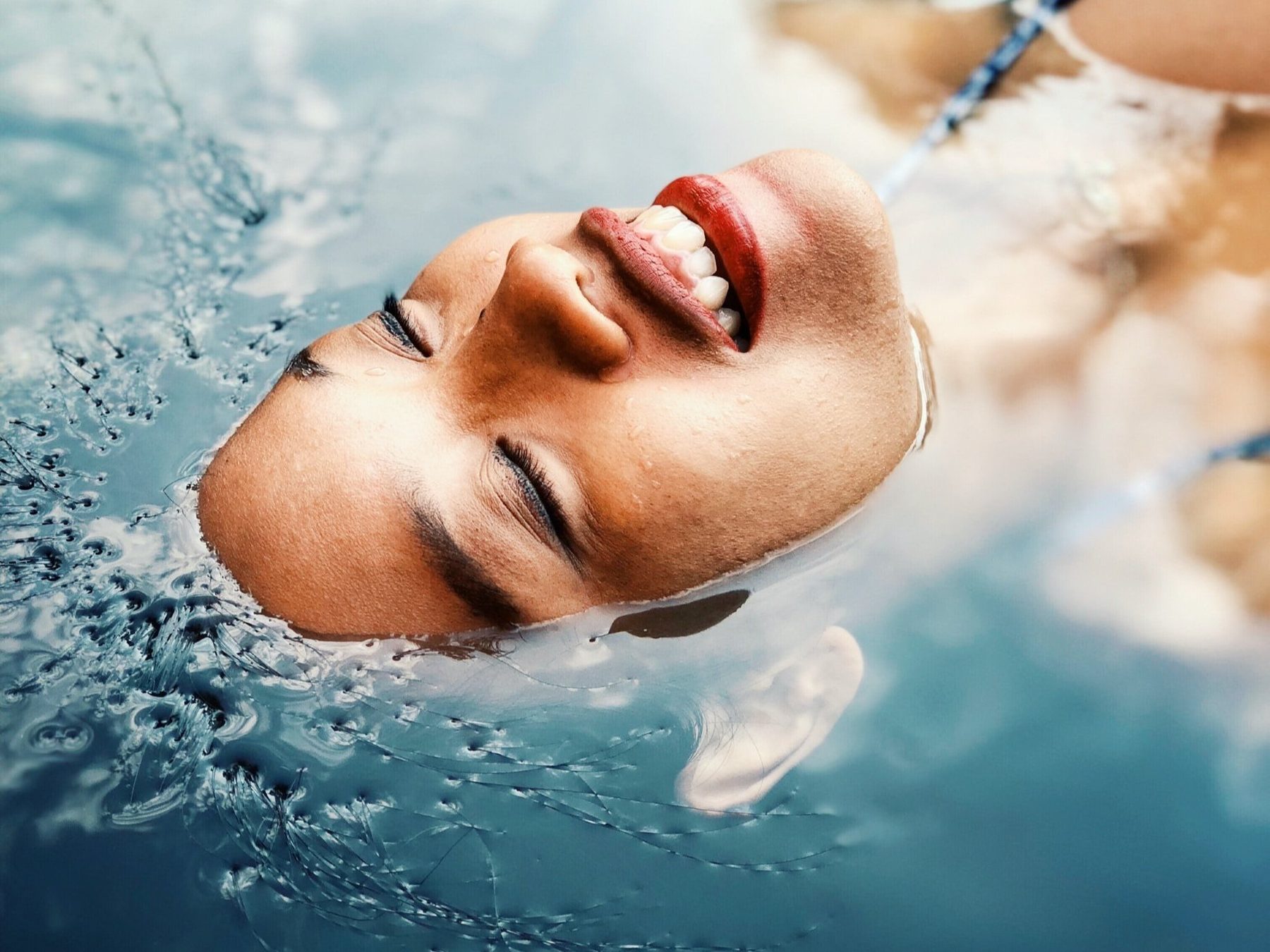 Woman floating relaxed in the water
