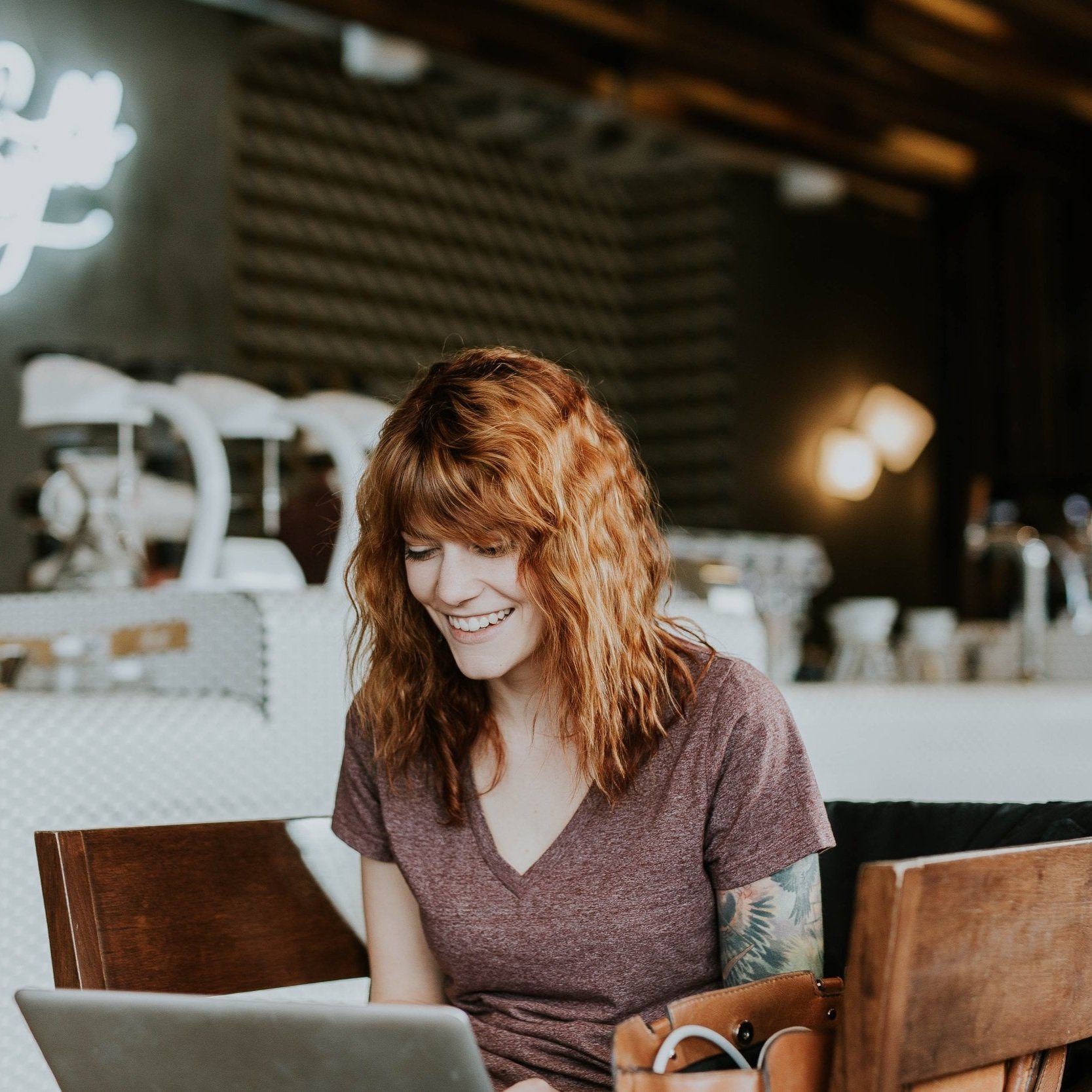 Confident freelancer woman working remotely from her computer